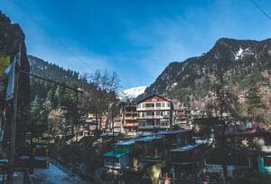 Old Manali surrounded by forests and hills, representing scenic places to visit in Manali Himachal Pradesh.
