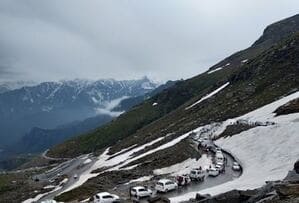 Snowy Rohtang Pass with dramatic Himalayan views, one of the highest places to visit in Manali Himachal Pradesh.