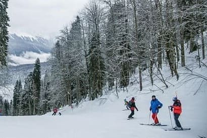 Skiing on snow-covered slopes in Manali, among the top winter places to visit in Manali Himachal Pradesh.
